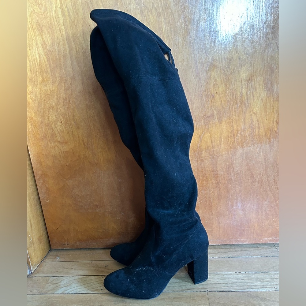 Knee high black zip up boots with tie at top